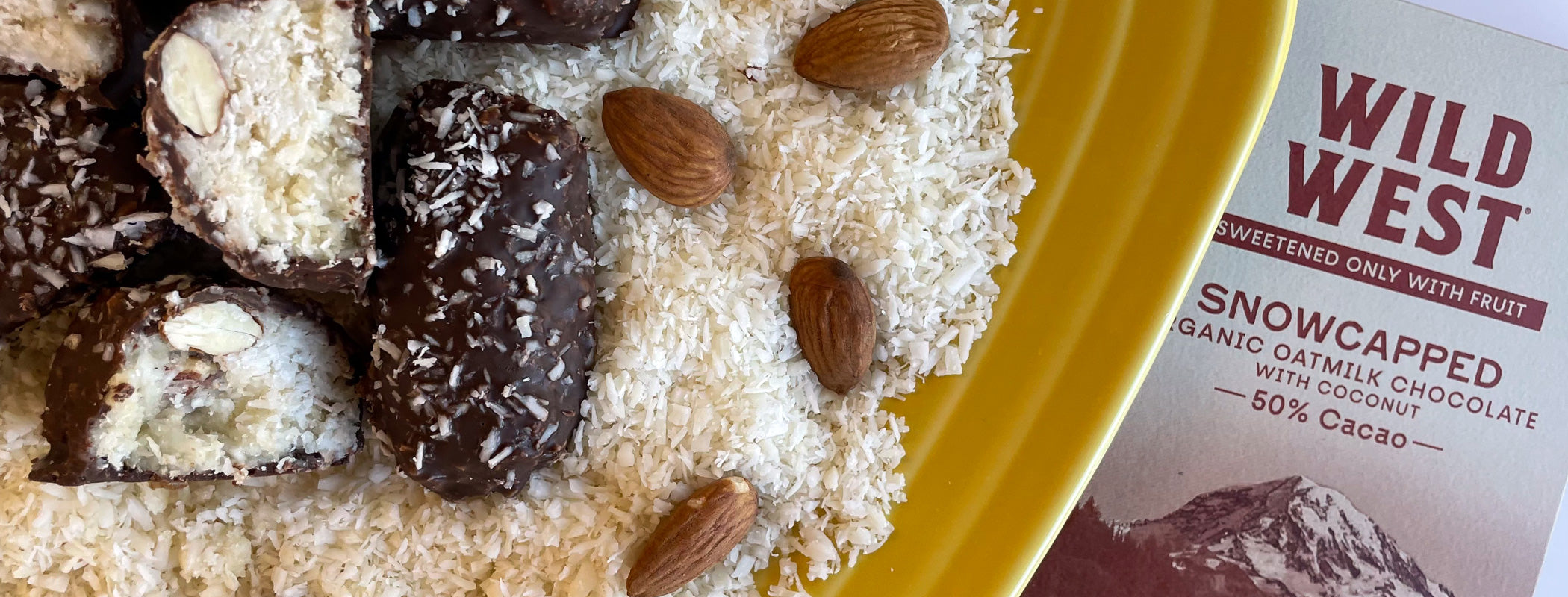 Close up image of homemade almond joy bars with coconut, almonds, and dark chocolate