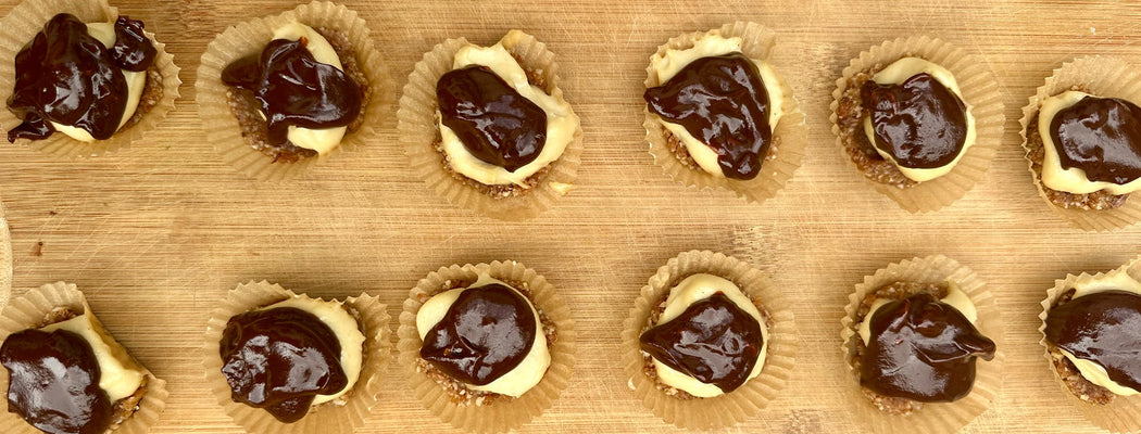 No-bake chocolate ganache tartlets arranged on plate