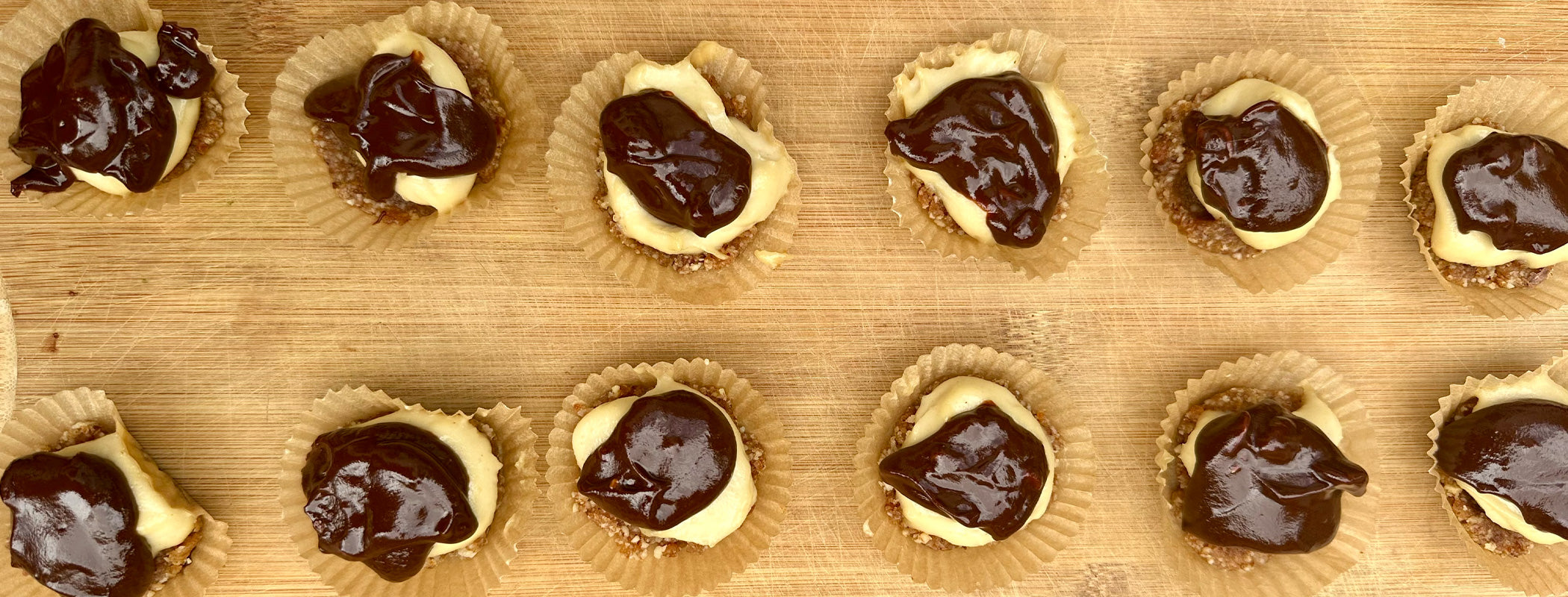 No-bake chocolate ganache tartlets arranged on plate