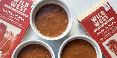 3 ramekins of pots de creme with Wild West Dark Horse chocolate bars