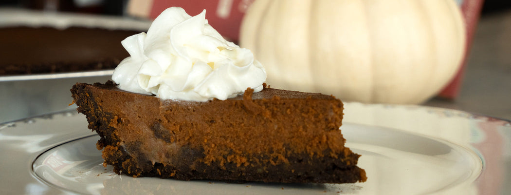 Slice of pumpkin chocolate pie with whipped cream