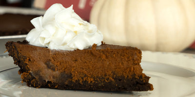 Slice of pumpkin chocolate pie with whipped cream