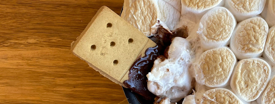 Warm s'mores skillet dip with melted chocolate and toasted marshmallows