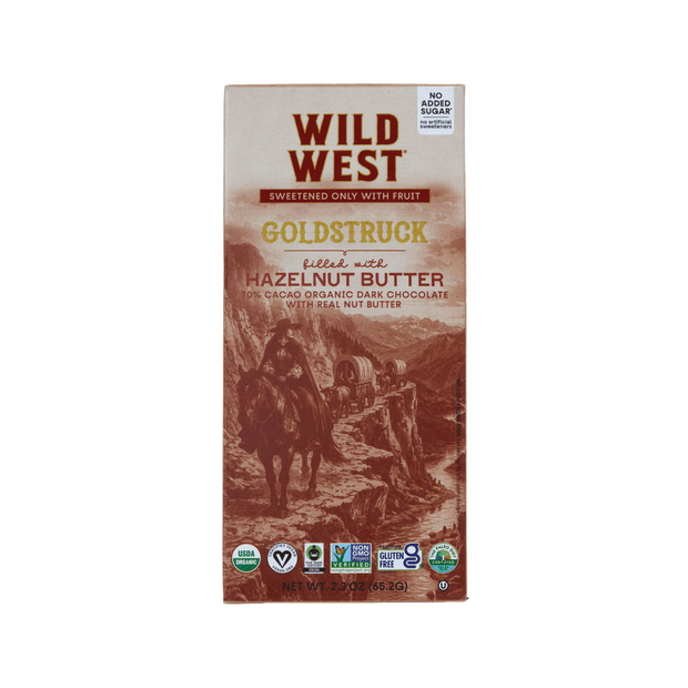 Wild West Goldstruck Hazelnut Butter chocolate bar packaging, featuring a sepia-toned western illustration of a rider on horseback and a cowboy in a landscape, with the brand name 'Wild West' in bold red letters at the top.